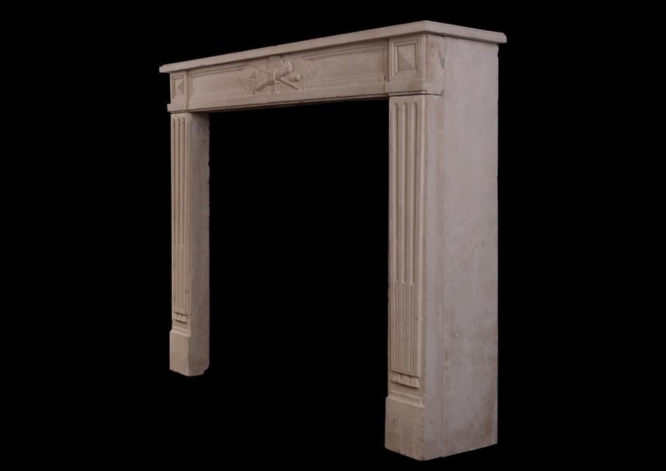 A Louis XVI style French limestone antique fireplace