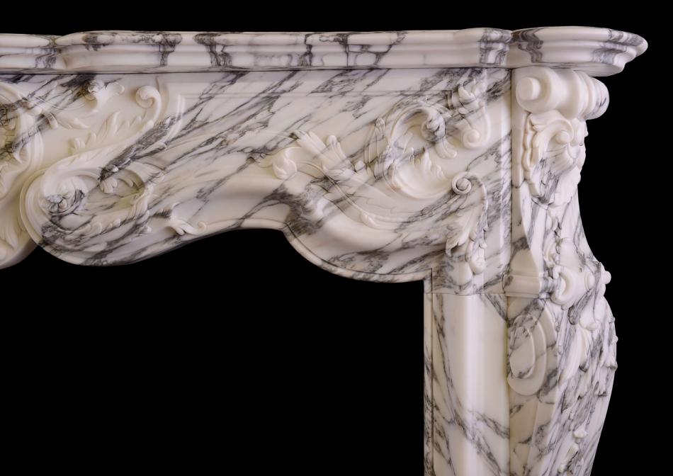 A Louis XV style fireplace in Italian Arabescato marble