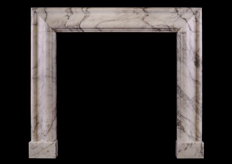 An English moulded bolection fireplace in Italian Arabescato marble