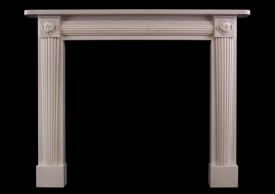 A white marble fireplace in the Regency manner