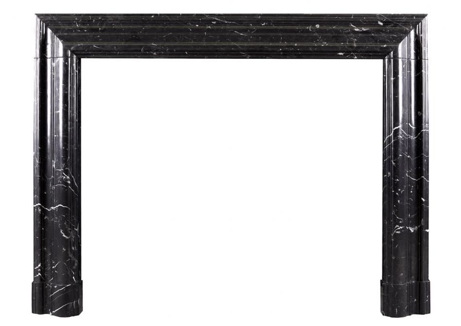 A bolection fireplace in Nero Marquina marble