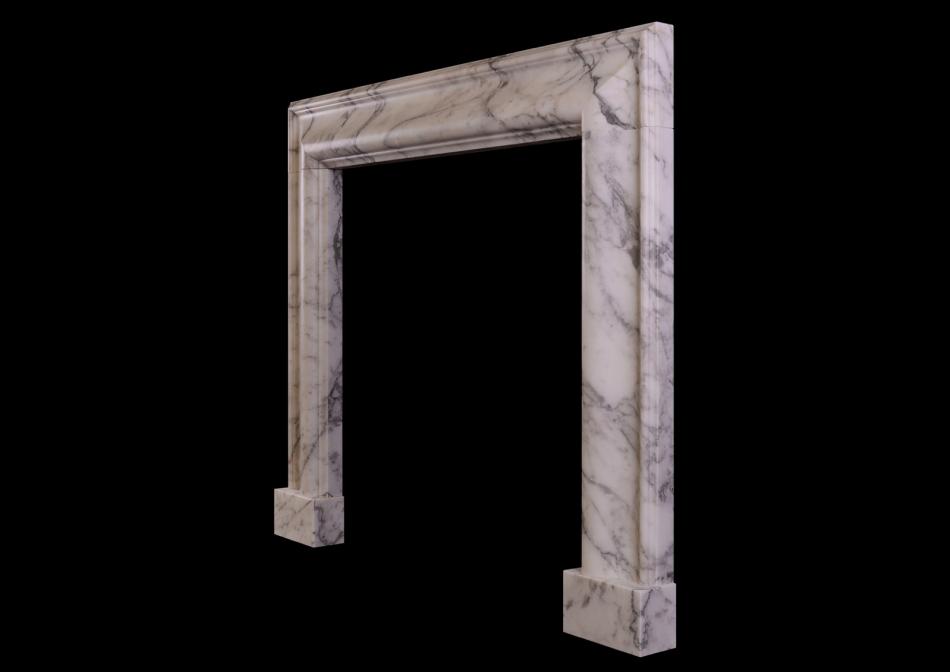 An English moulded bolection fireplace in Italian Arabescato marble