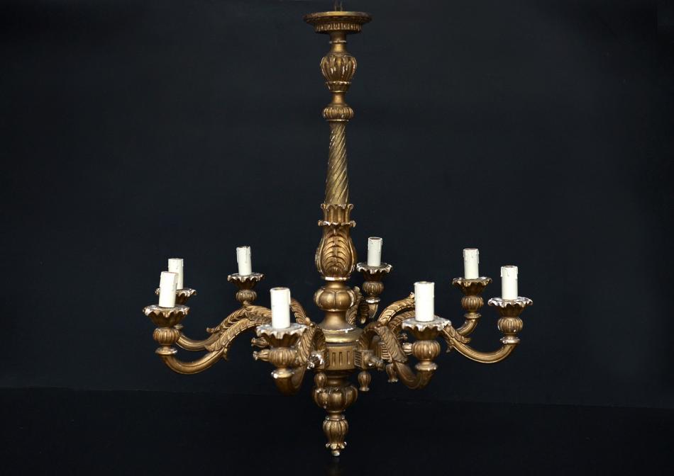 A gilt timber eight armed chandelier