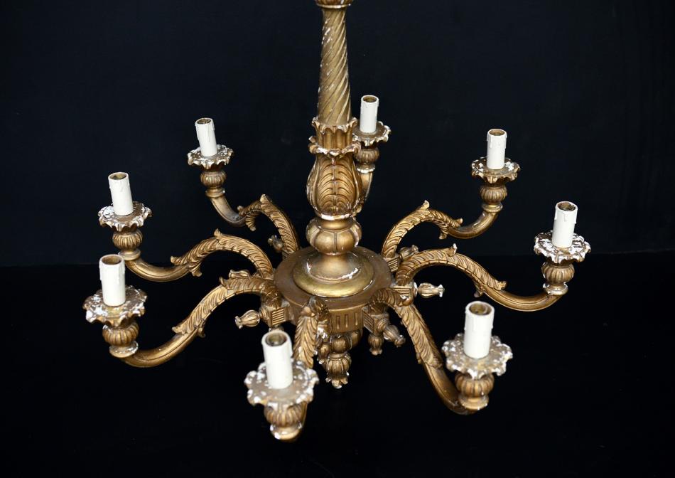 A gilt timber eight armed chandelier