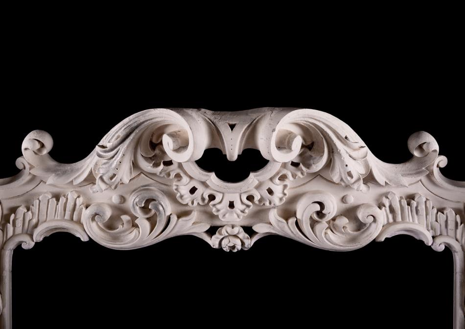 A highly decorative Rococo timber fireplace