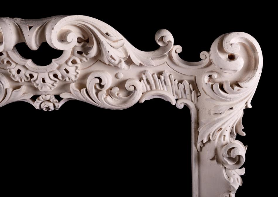 A highly decorative Rococo timber fireplace