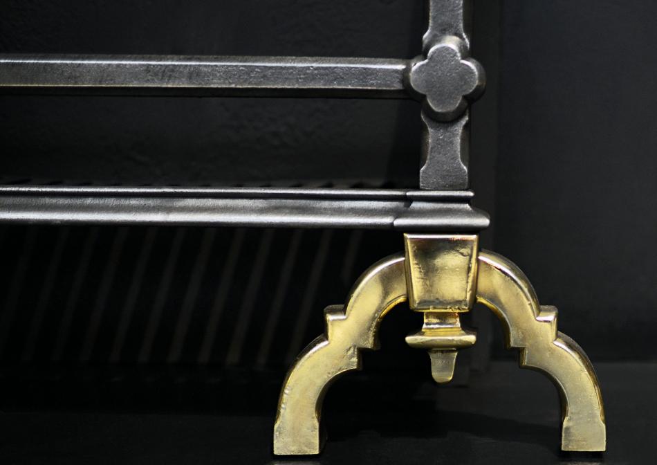 A brass and cast iron firegrate