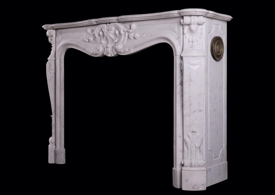 A 19th century French marble fireplace in the Louis XV manner