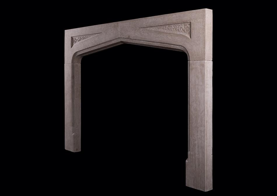 A carved Gothic stone fireplace