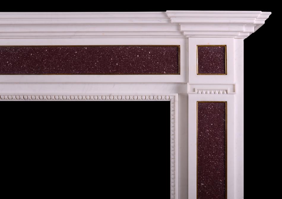 A white marble and Porphyry fireplace in the Regency manner