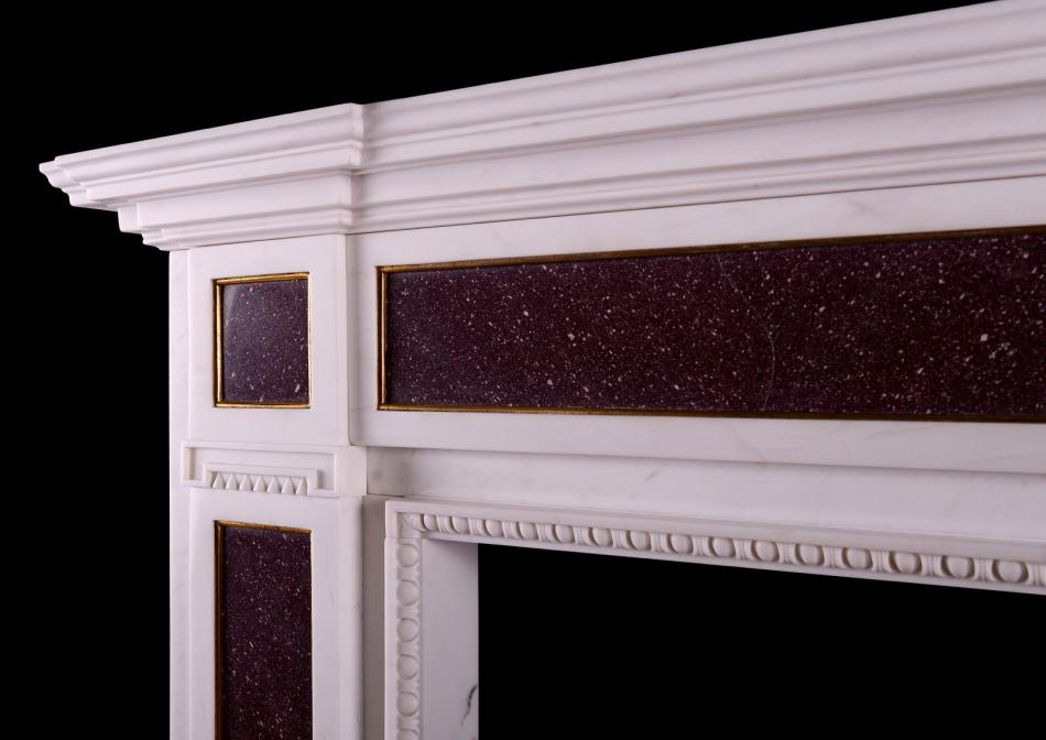 A white marble and Porphyry fireplace in the Regency manner