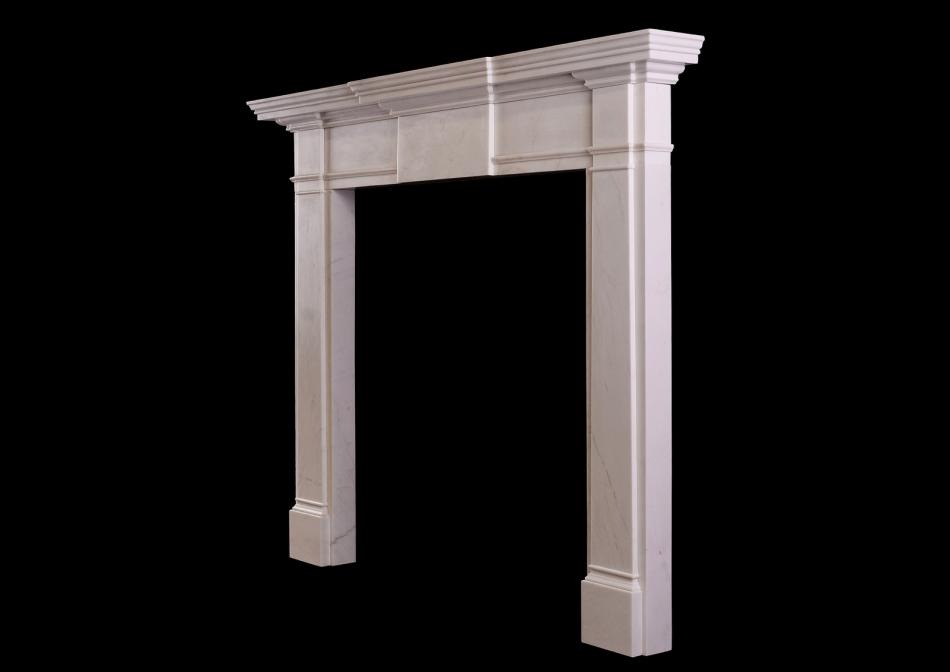 An mid-sized English fireplace in white marble
