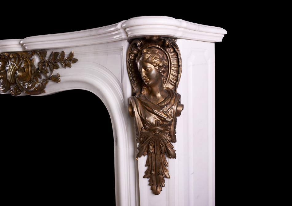 A Statuary marble fireplace with bronze ormolu