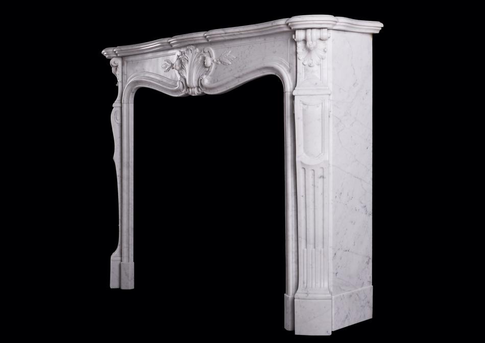 A Carrara marble fireplace in the Louis XV manner