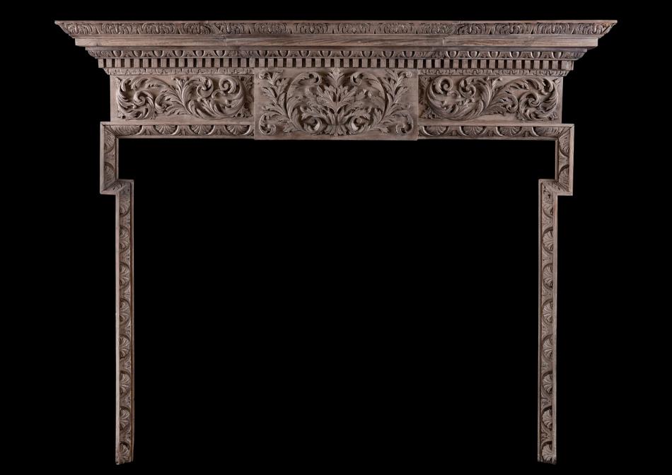 A carved timber fireplace in the Georgian style