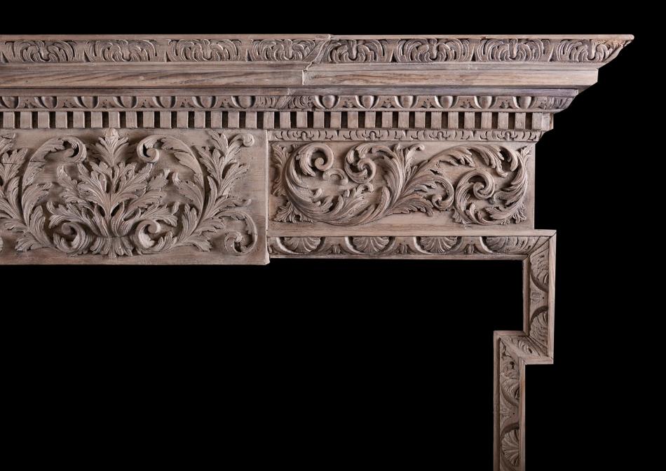 A carved timber fireplace in the Georgian style
