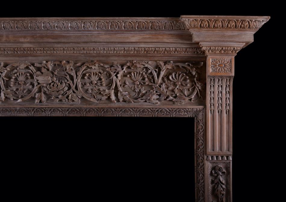 A large and impressive carved wood fireplace