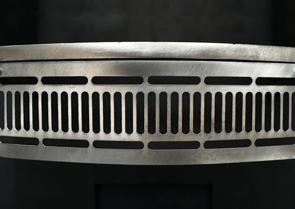 A simple polished steel firegrate