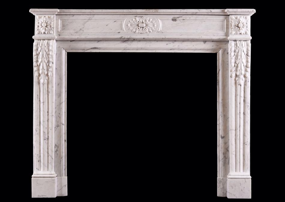 A Louis XVI style Carrara marble fireplace