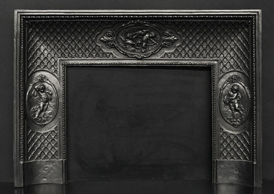 A decorative cast iron fireplace insert