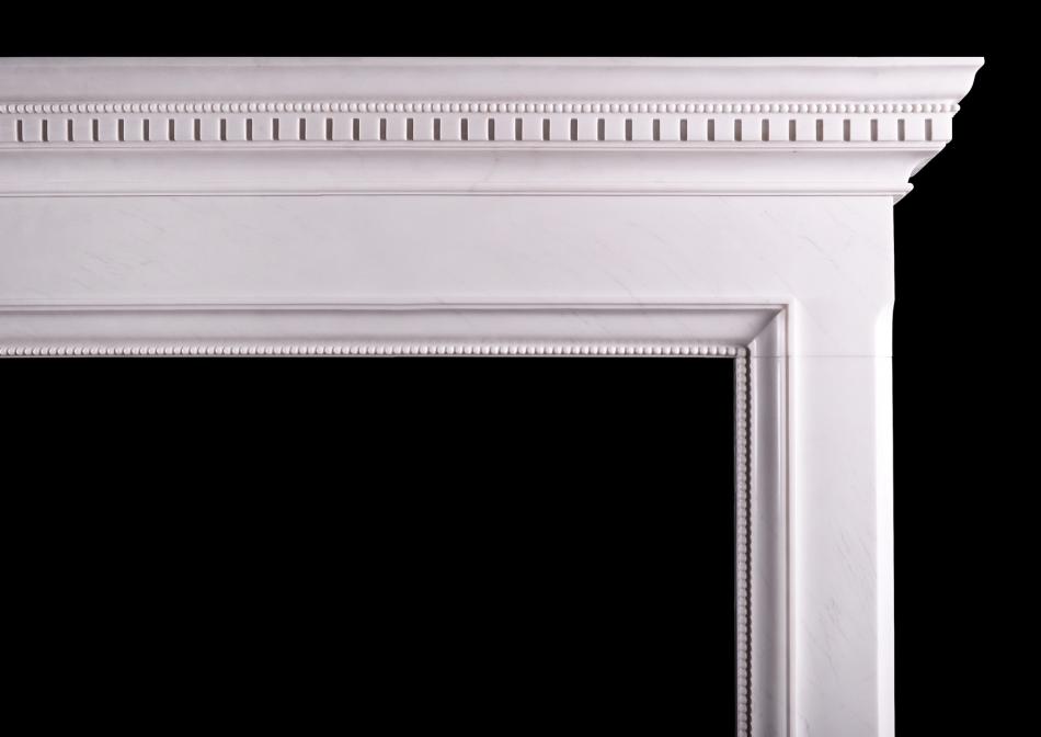 A Georgian style white marble fireplace