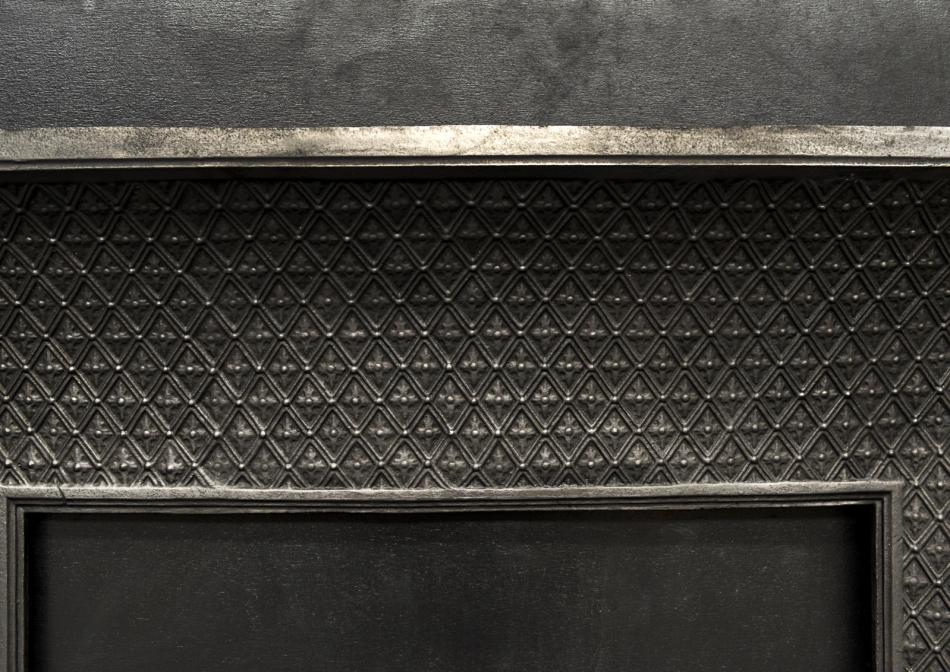 A decorative cast iron contracoeure insert