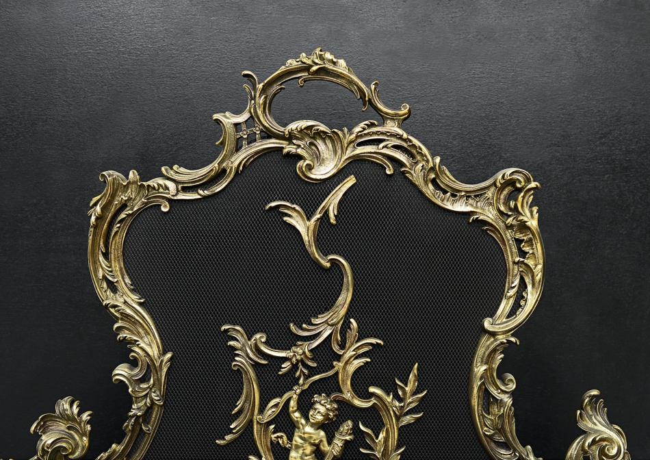 A French Louis XV style brass firescreen