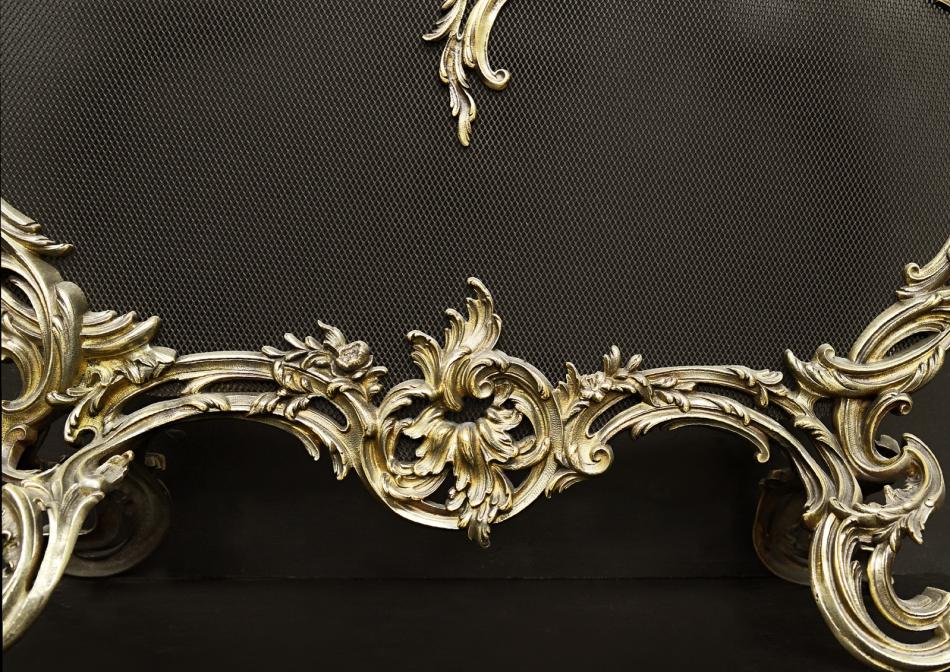 A French Louis XV style brass firescreen