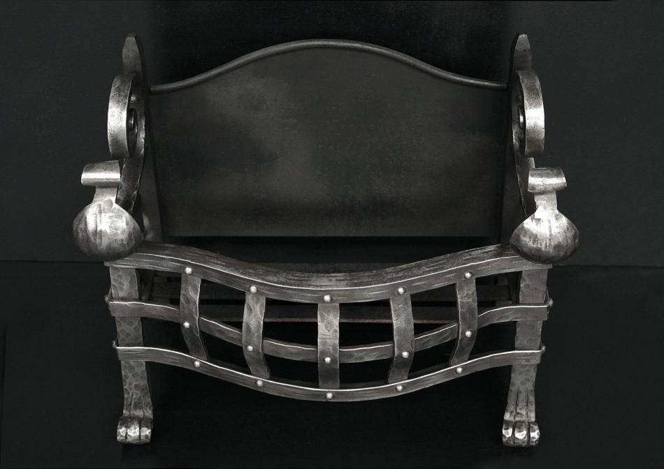 A small Gothic style wrought iron firegrate