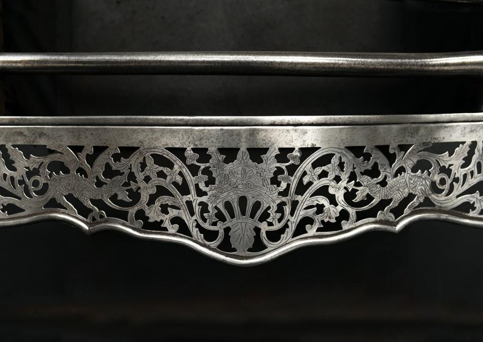 A Georgian style polished steel firegrate