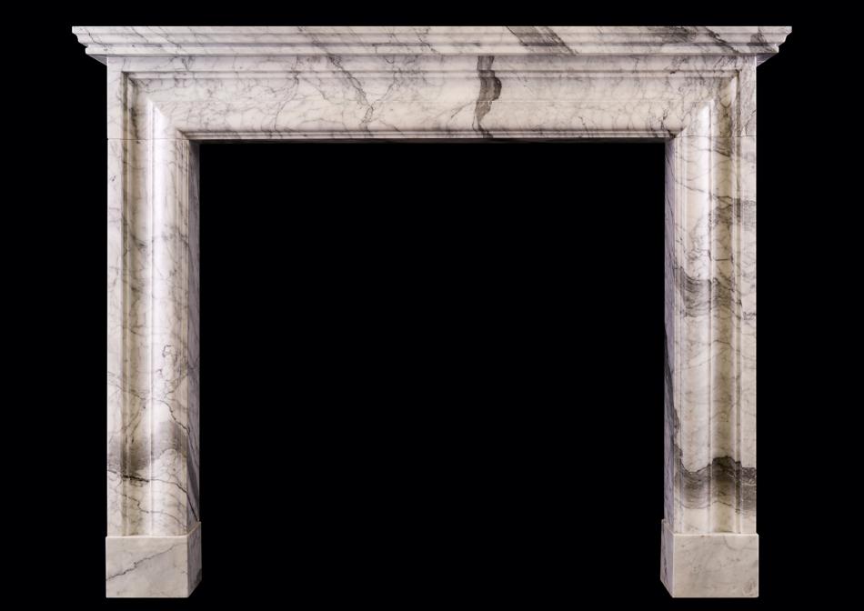 An English moulded fireplace in Arabescato marble