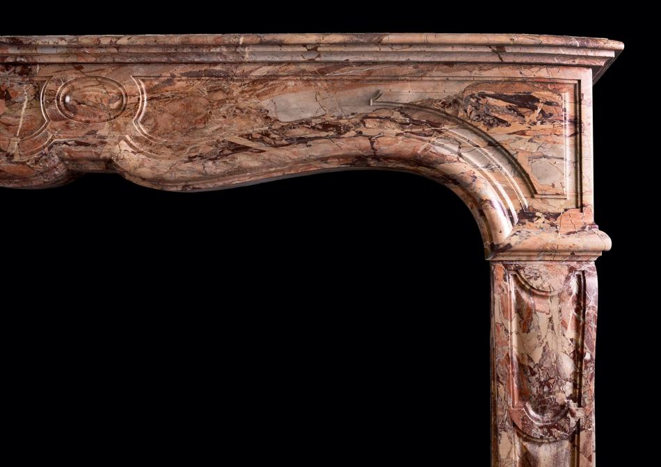 A Sarrancolin marble fireplace in the Louis XV style