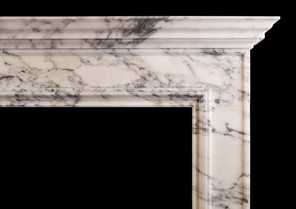 An Italian Arabescato marble fireplace of architectural form