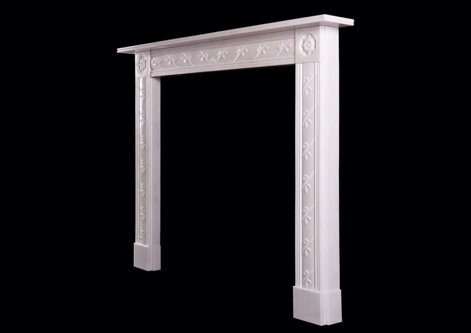 A delicate English Regency white marble fireplace