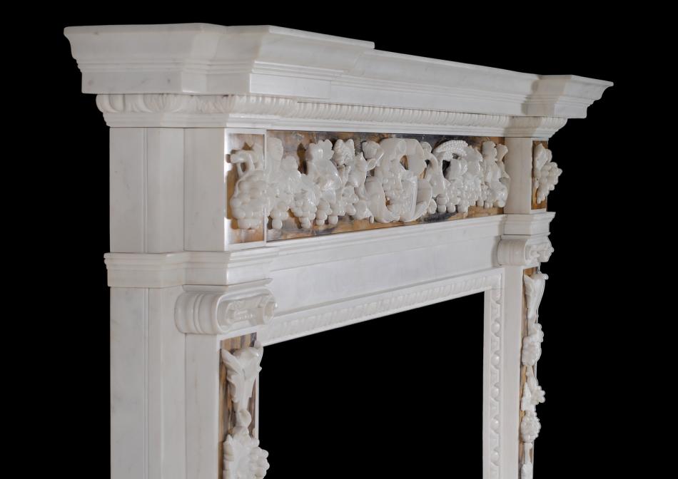 An English George II white marble fireplace with Siena inlay