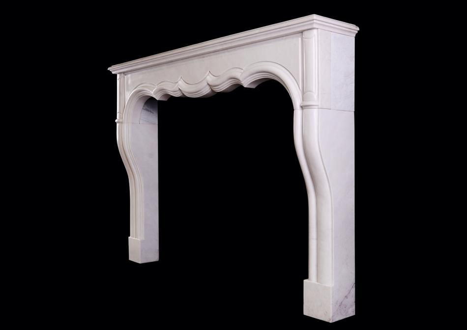 A transitional French LXIV / LXV style fireplace