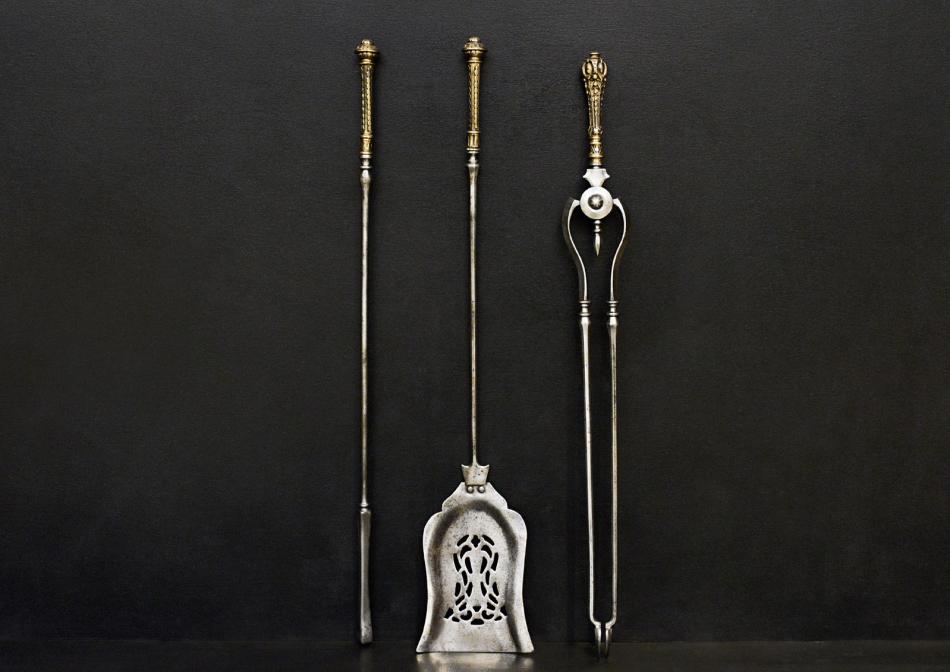 A set of Georgian style brass and steel firetools