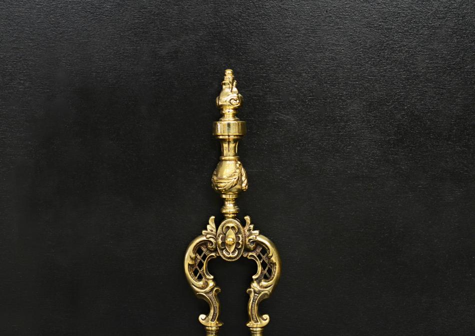A set of brass Victorian firetools