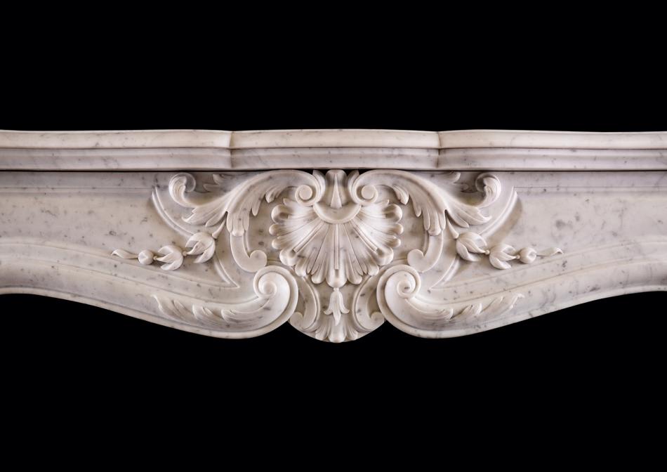 A 19th century French marble fireplace in the Louis XV style