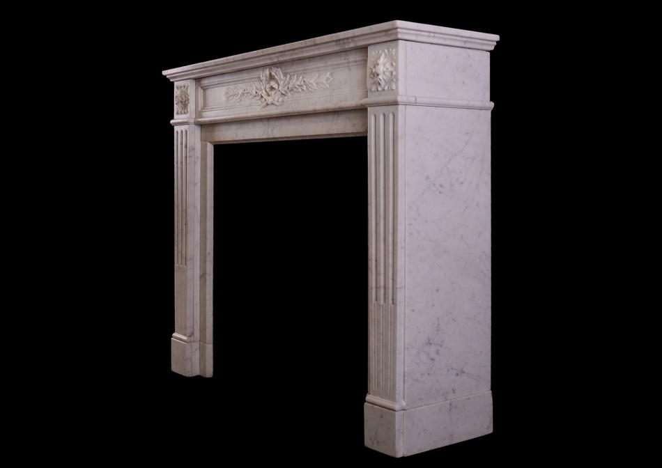 A Louis XVI style marble fireplace