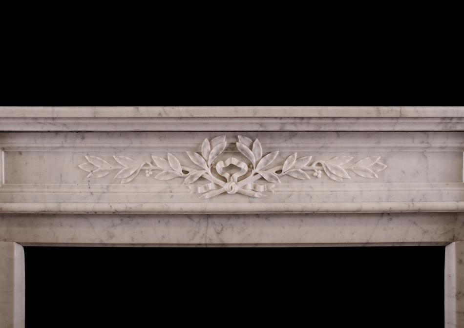 A Louis XVI style marble fireplace