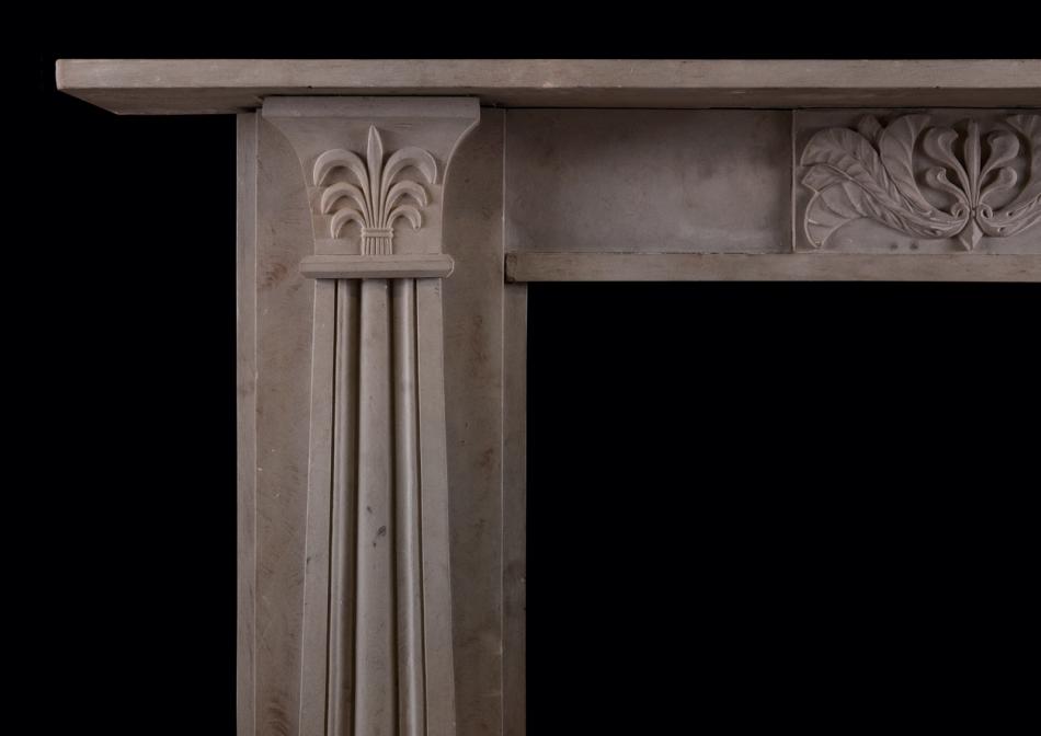 An English stone fireplace in the Regency style