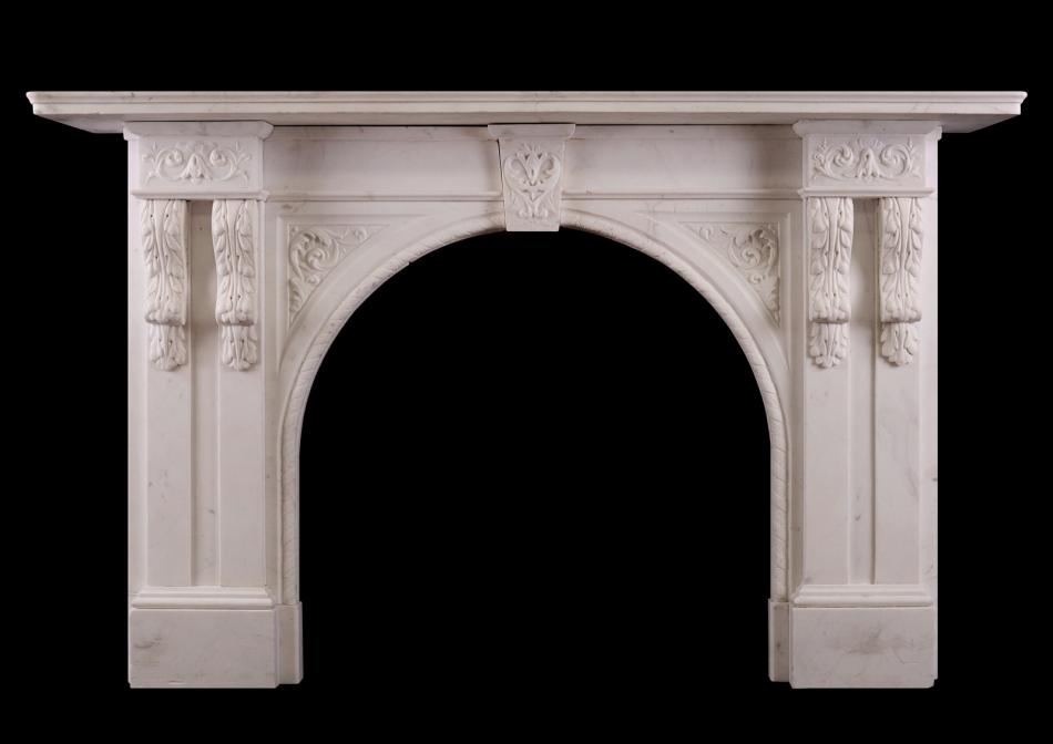 A carved arched marble fireplace