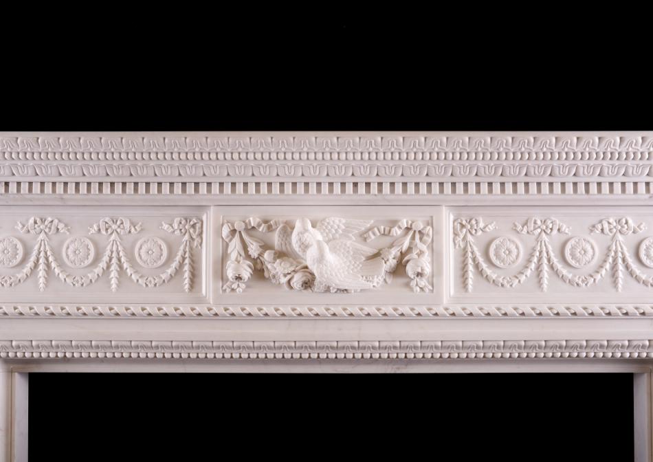 A FINELY CARVED MARBLE FIREPLACE