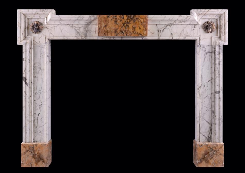 An early Georgian Siena and Statuary marble fireplace