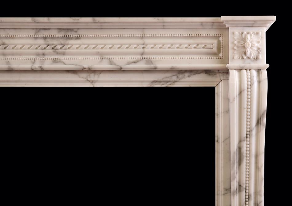 A Louis XVI style French marble fireplace