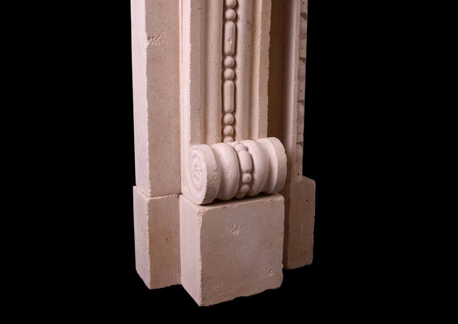 An English stone fireplace in the Georgian manner