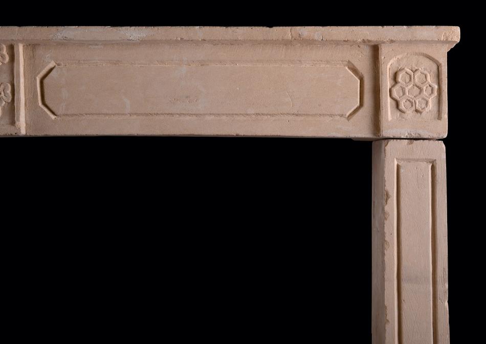 An early 19th century French Empire limestone fireplace