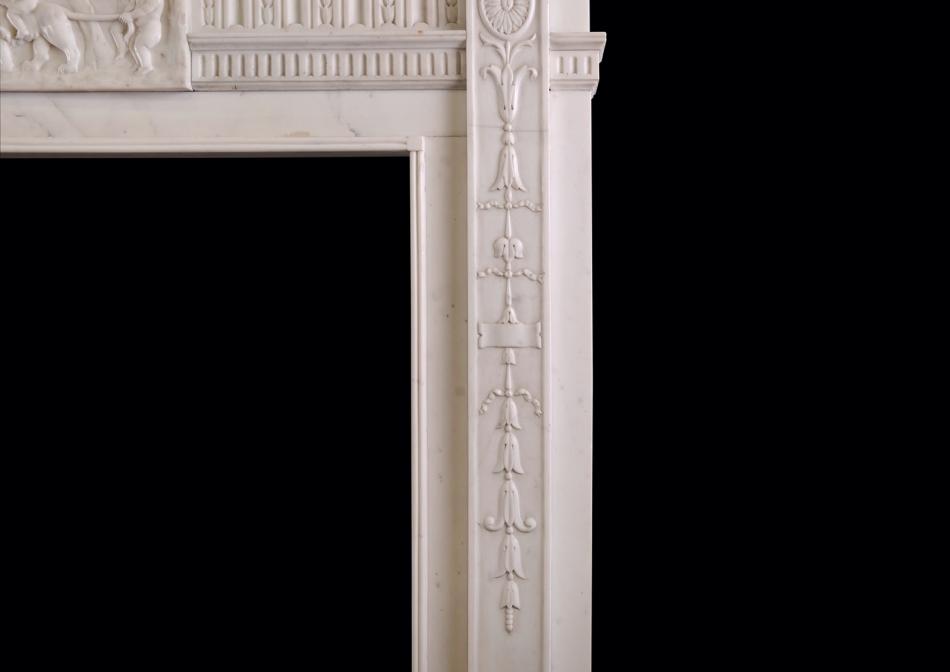 A carved Statuary marble fireplace in the Georgian style