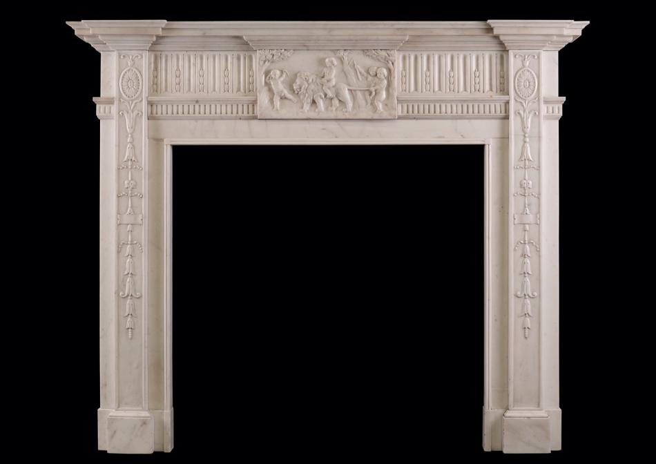 A carved Statuary marble fireplace in the Georgian style